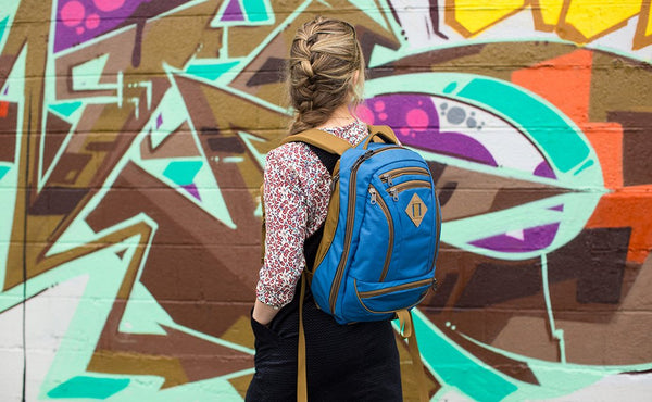 A person with a small frame wearing a Guide's Edition Synik 22.